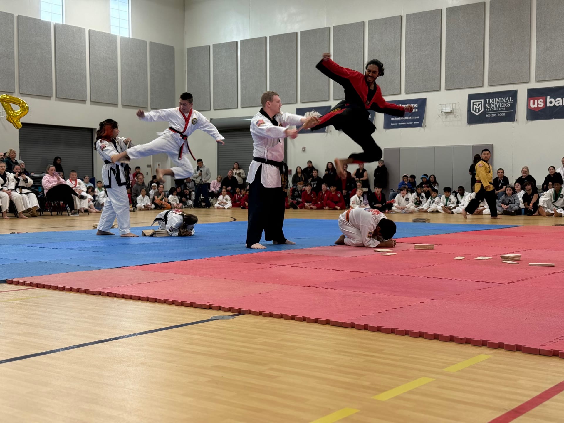 Students practicing high kicks